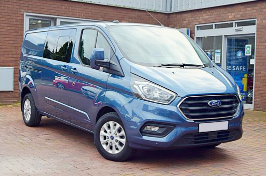 blue ford transit custom van in a forecourt