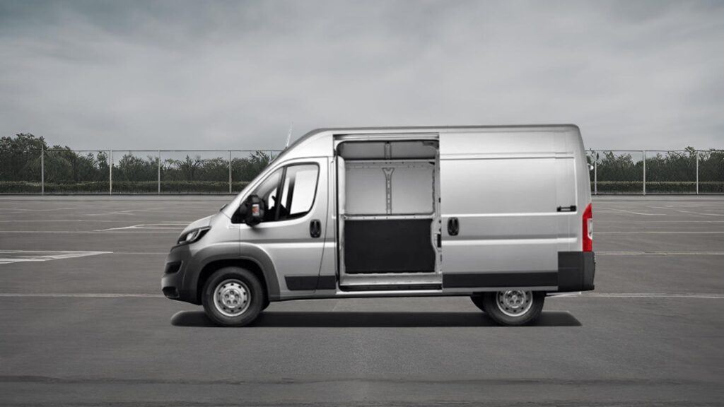 Peugeot Boxer with sliding doors open on a parking lot